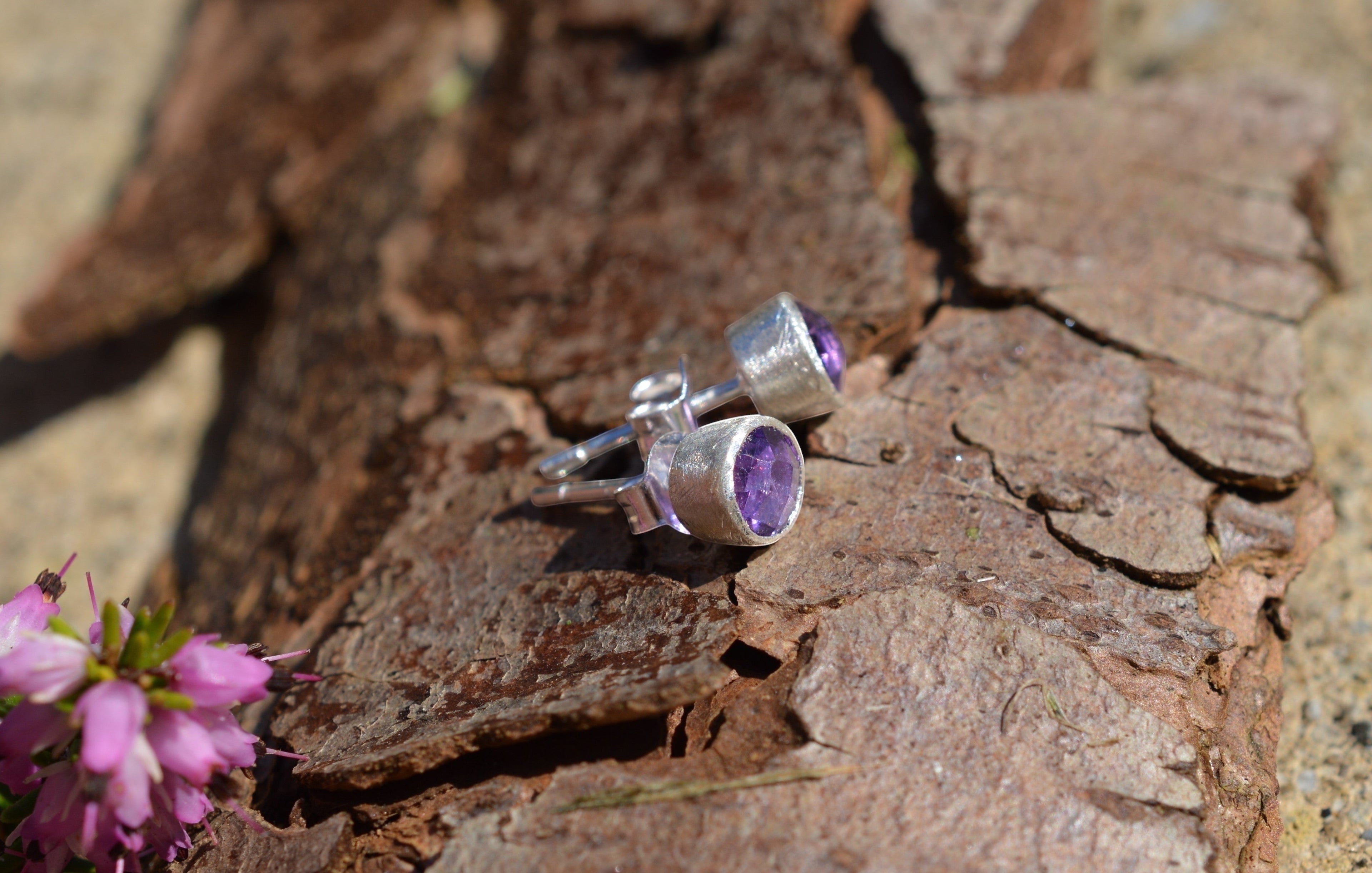 Blue Dragonfly Creations handmade rose cut amethyst stud earrings in satin finish sterling silver on tree bark