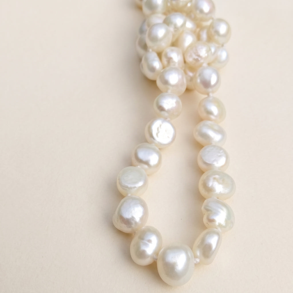 Blue Dragonfly Creations hand-knotted white baroque freshwater pearl necklace with lustrous unique shapes