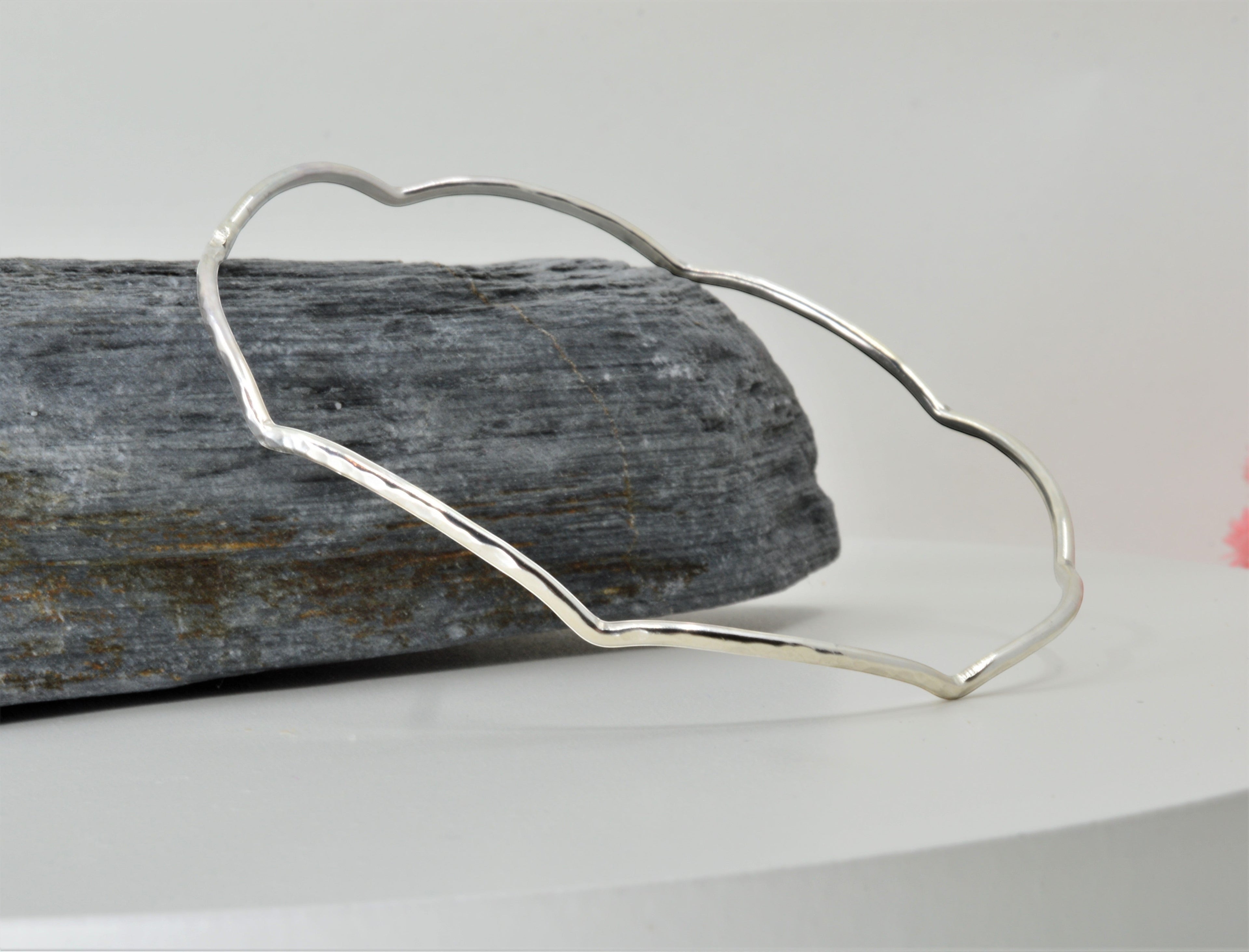Blue Dragonfly Creations handmade sterling silver bangle with a hammered wave texture and polished finish.