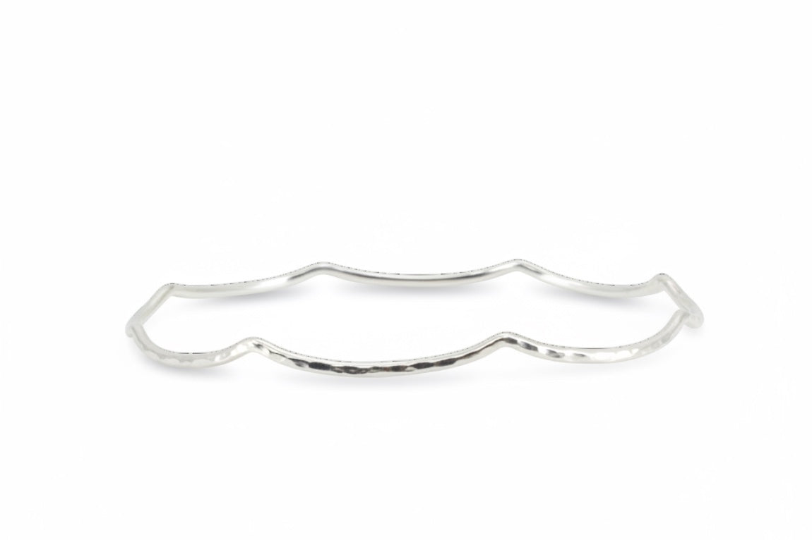 Blue Dragonfly Creations handmade sterling silver bangle with a delicate hammered wave texture and polished finish.