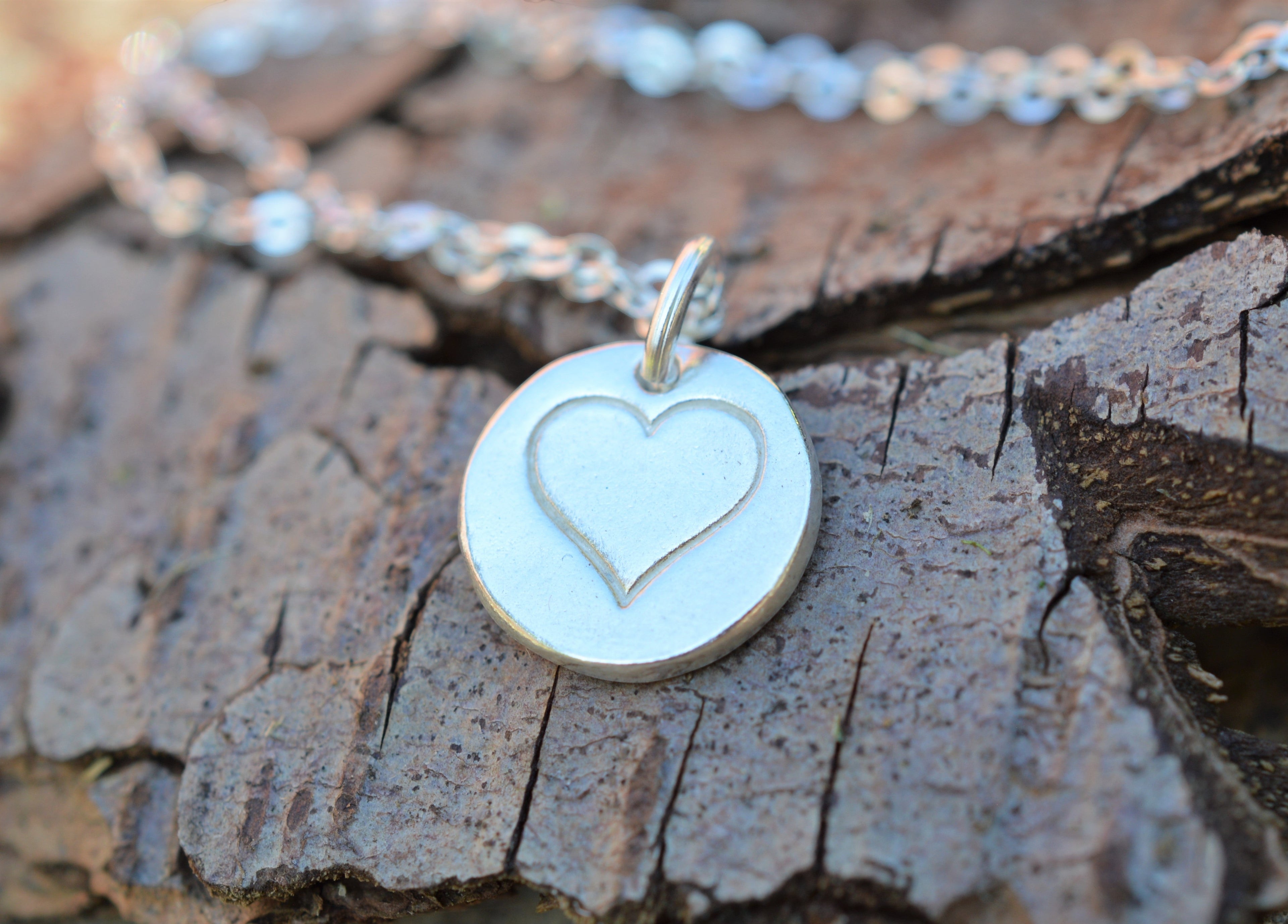 Blue Dragonfly Creations minimalist heart pendant necklace in fine silver on a 925 sterling silver chain.