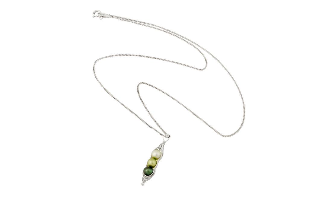 Blue Dragonfly Creations sterling silver pea pod necklace with three green freshwater pearls in a wire-wrapped pendant.