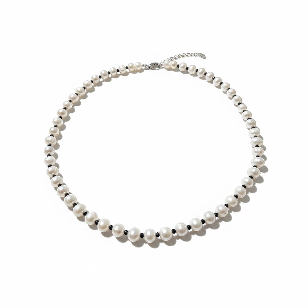 Blue Dragonfly Creations freshwater pearl necklace with alternating faceted black beads and sterling silver clasp.