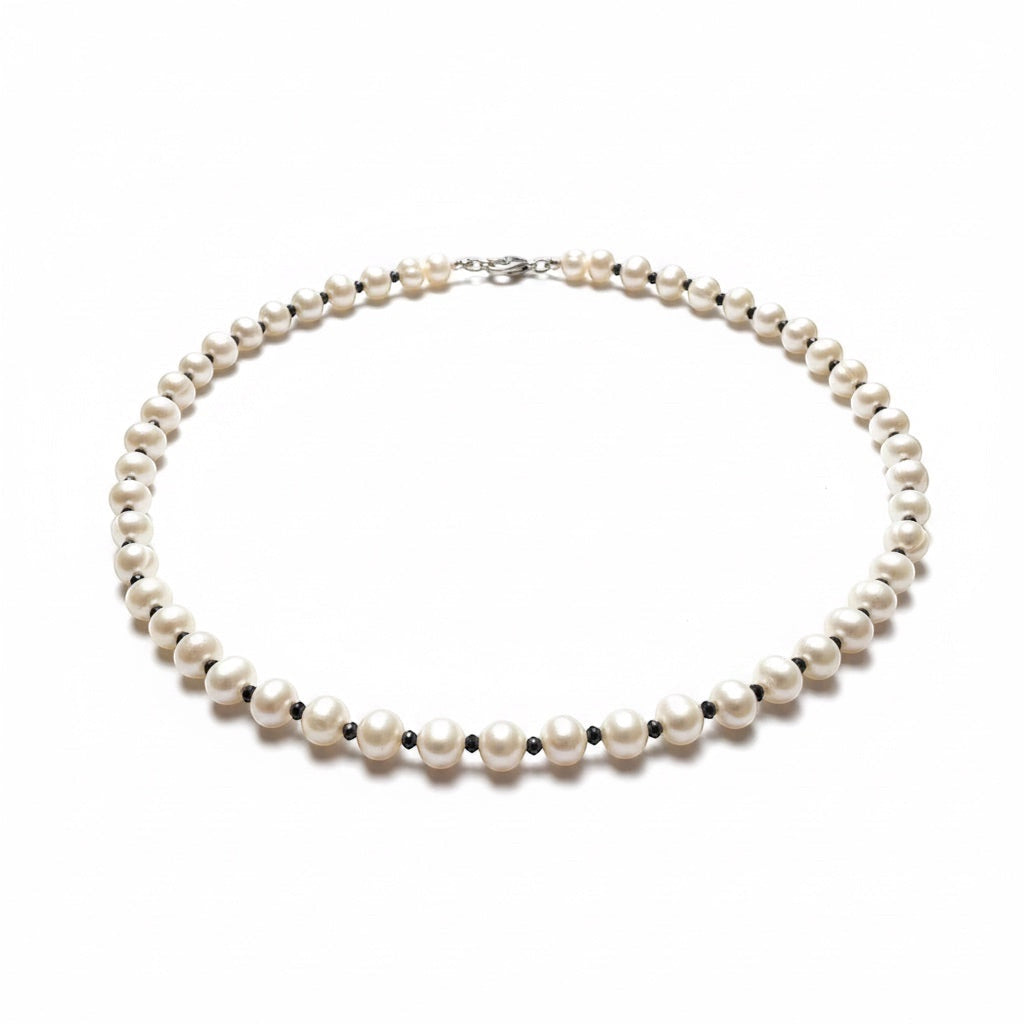 Blue Dragonfly Creations white freshwater pearl necklace with contrasting faceted black beads and sterling silver clasp