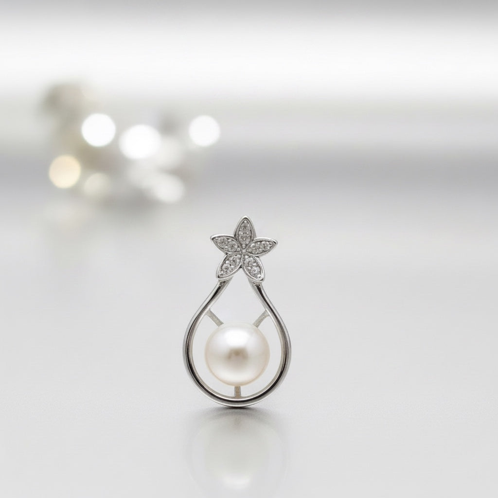 Blue Dragonfly Creations sterling silver pendant with a freshwater pearl and a crystal-encrusted flower design.