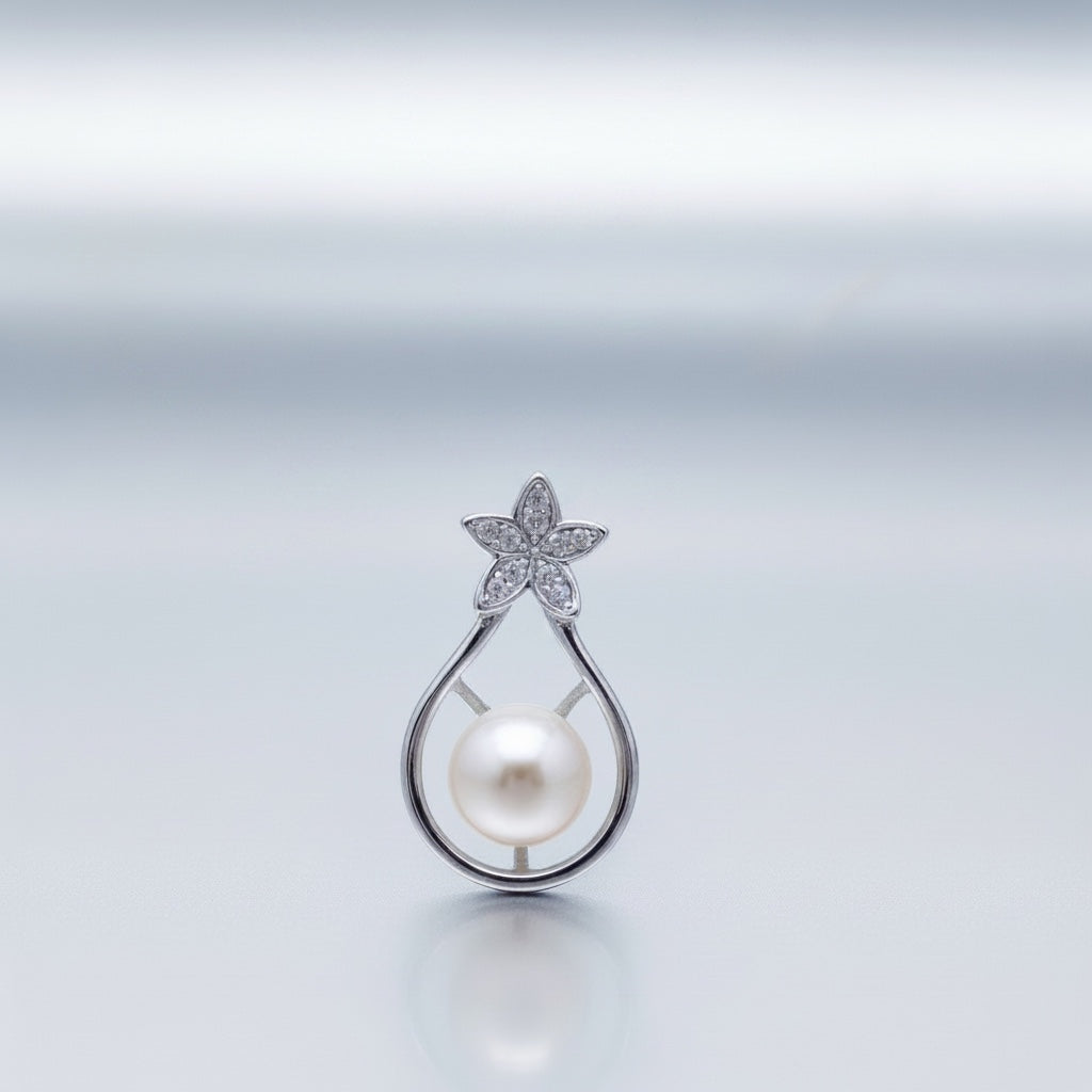 Blue Dragonfly Creations sterling silver pendant with a white freshwater pearl and a crystal flower accent.
