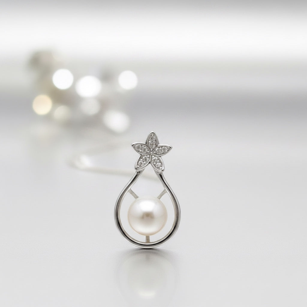 Blue Dragonfly Creations sterling silver pendant necklace with a white freshwater pearl and crystal flower detail.