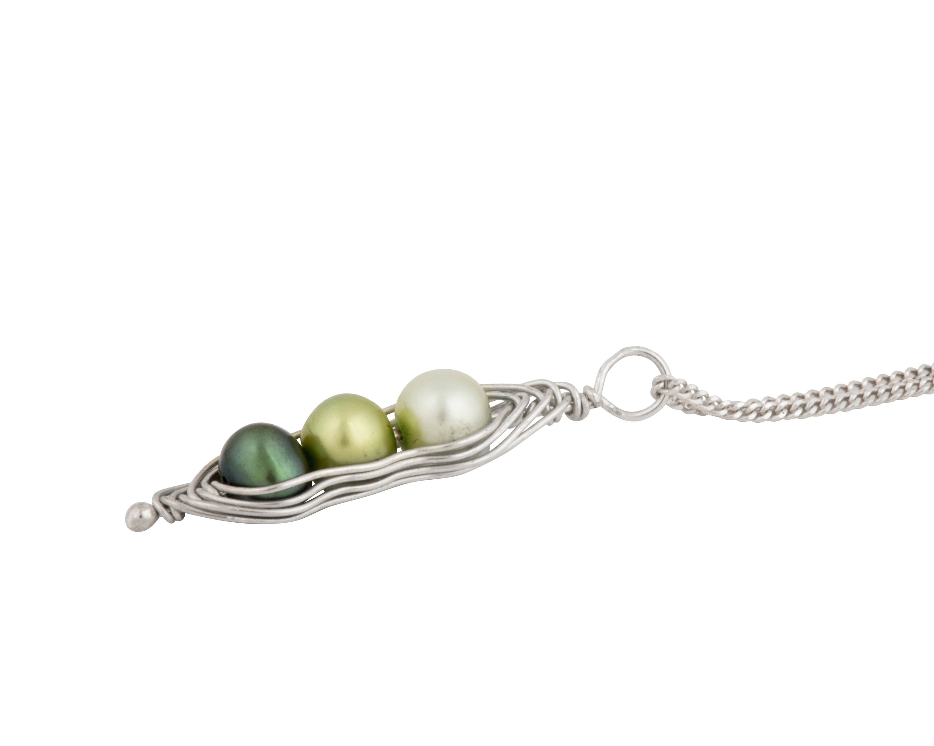 Blue Dragonfly Creations sterling silver pea pod necklace featuring three green freshwater pearls in a wire pod