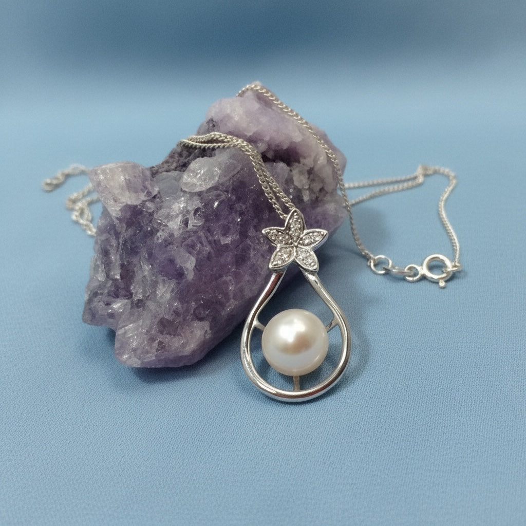 Blue Dragonfly Creations sterling silver pendant necklace with a freshwater pearl and crystal flower on amethyst