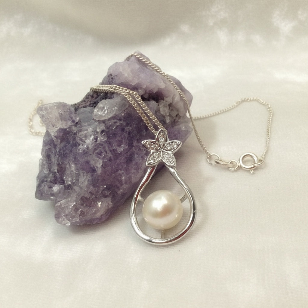 Blue Dragonfly Creations sterling silver pendant necklace featuring a white freshwater pearl and crystal flower charm.