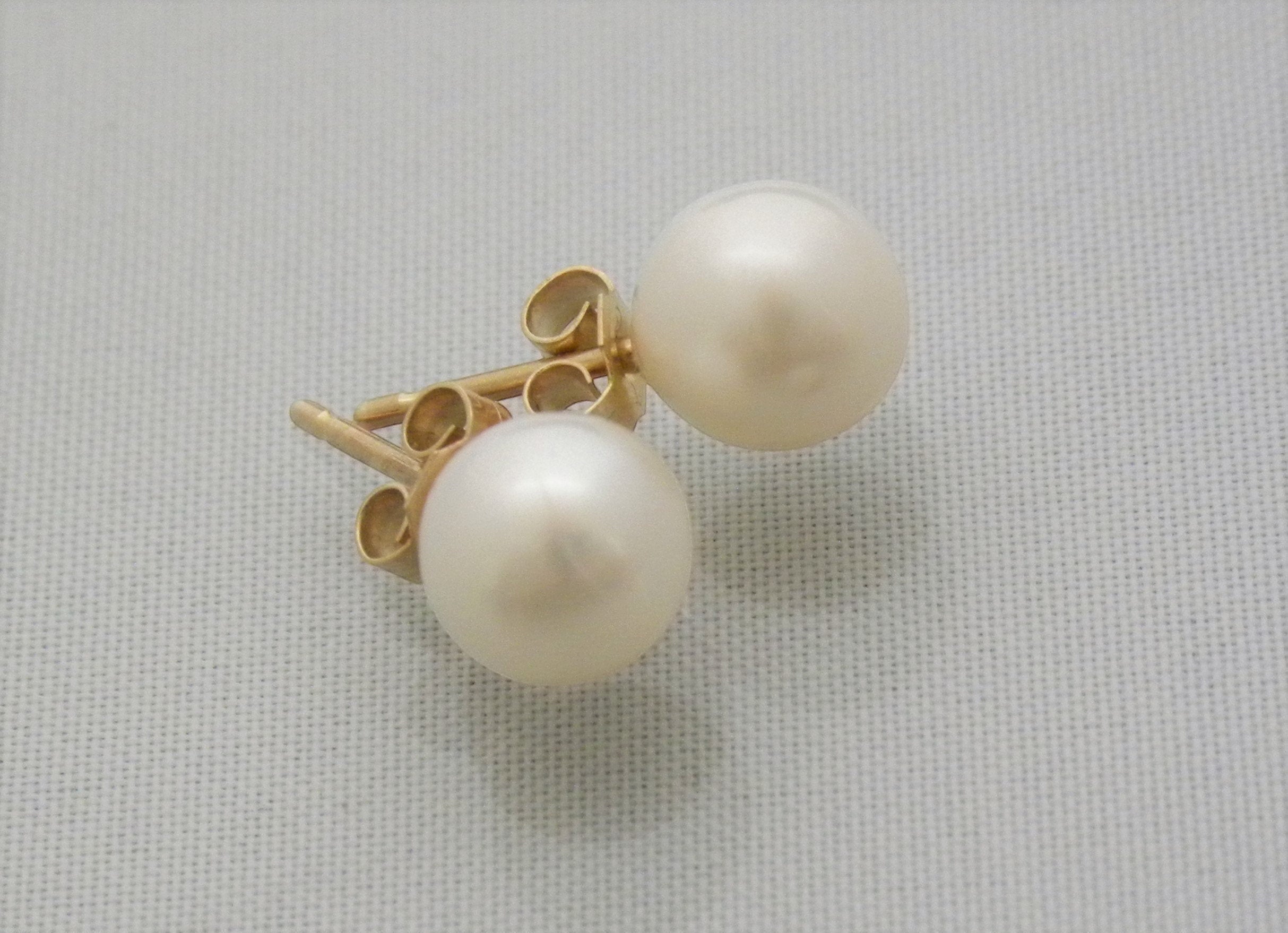 Blue Dragonfly Creations classic round pearl stud earrings with lustrous white pearls and gold-tone posts.