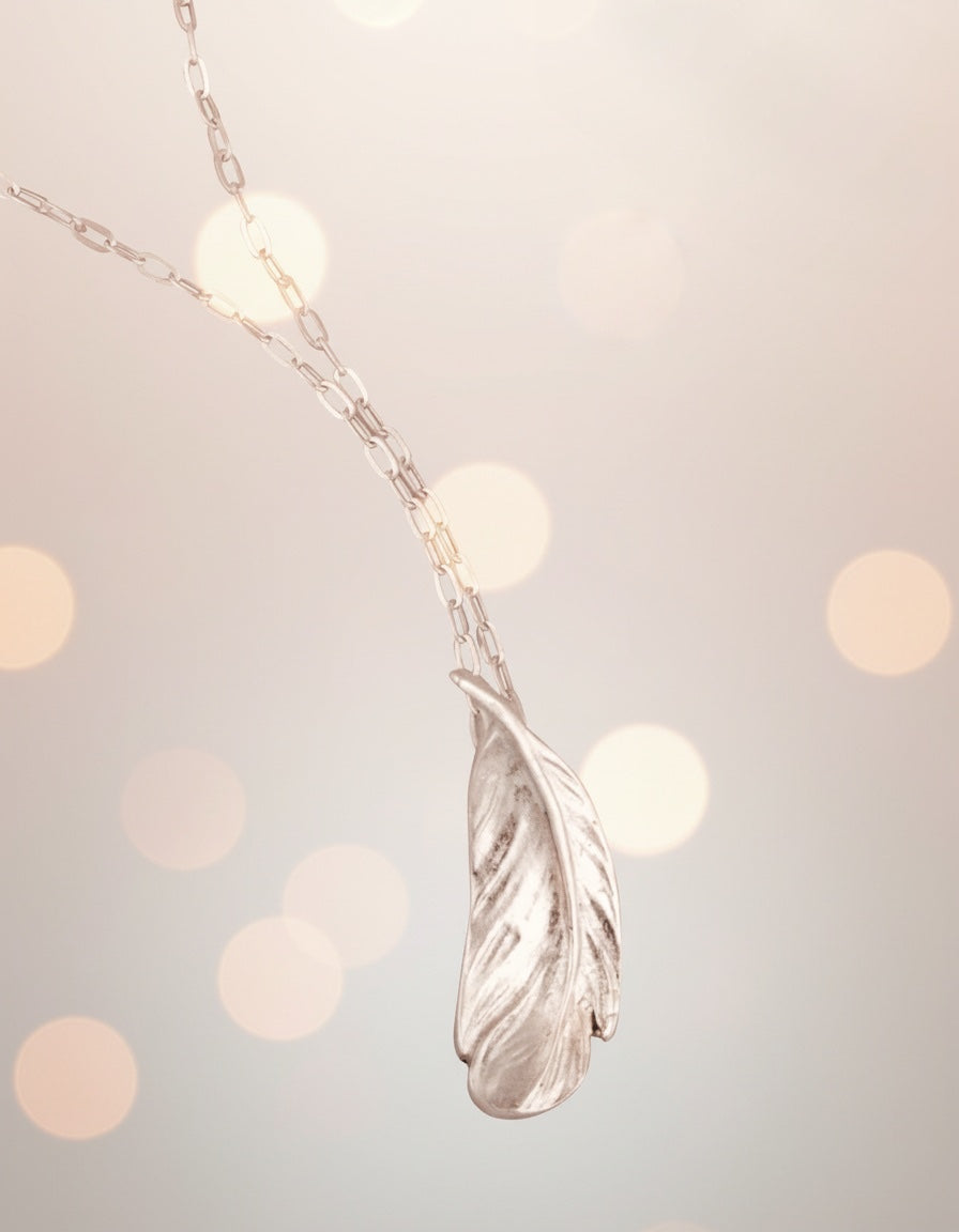 Blue Dragonfly Creations fine silver feather pendant necklace with delicate textured details on a sterling silver chain