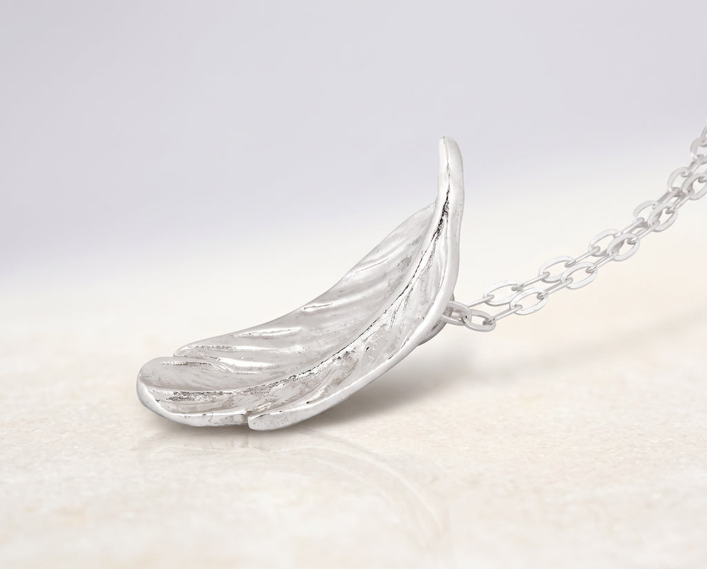 Blue Dragonfly Creations fine silver feather pendant necklace with detailed texture on a sterling silver chain