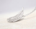Blue Dragonfly Creations fine silver feather pendant necklace with detailed texture on a sterling silver chain