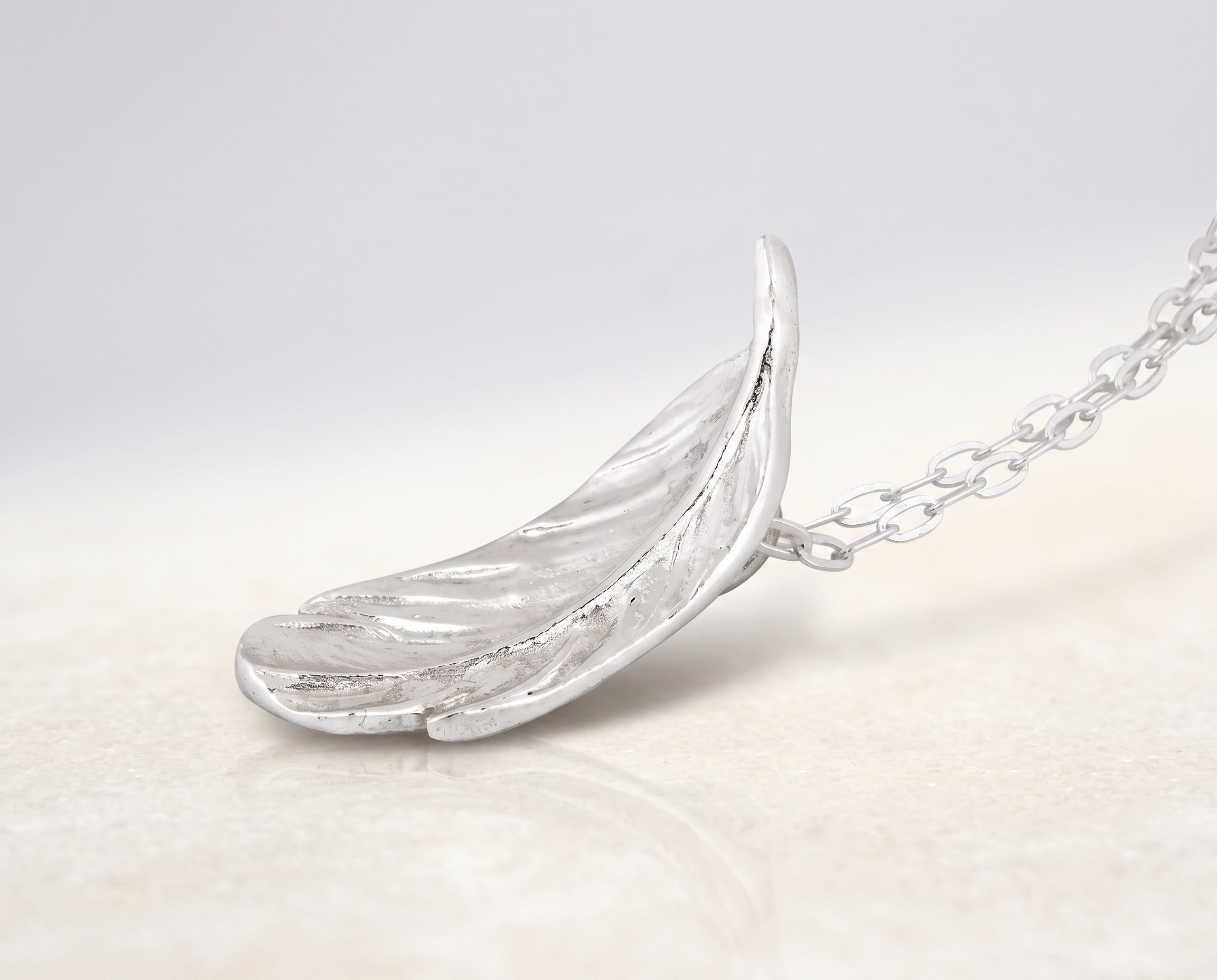 Blue Dragonfly Creations fine silver feather pendant necklace with detailed texture on a sterling silver chain