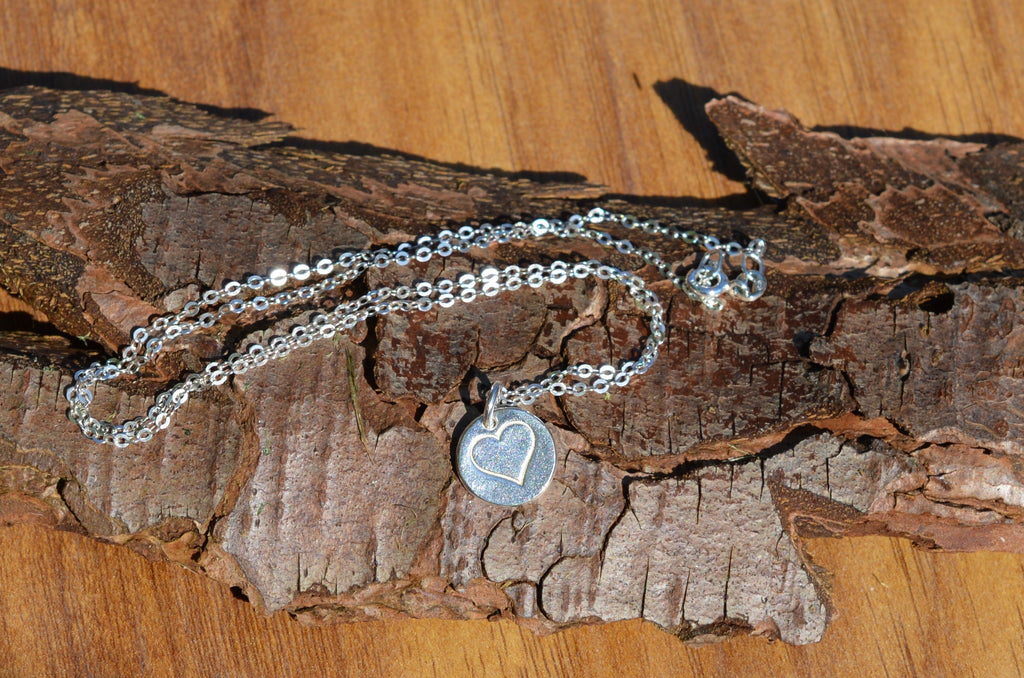 Blue Dragonfly Creations minimalist fine silver heart pendant necklace on a delicate 925 sterling silver chain.