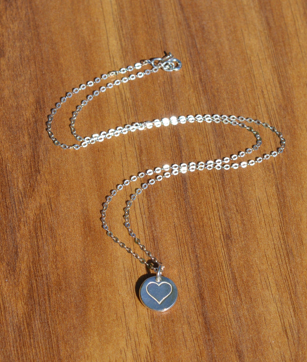 Blue Dragonfly Creations minimalist fine silver heart pendant necklace on a delicate 925 sterling silver chain.