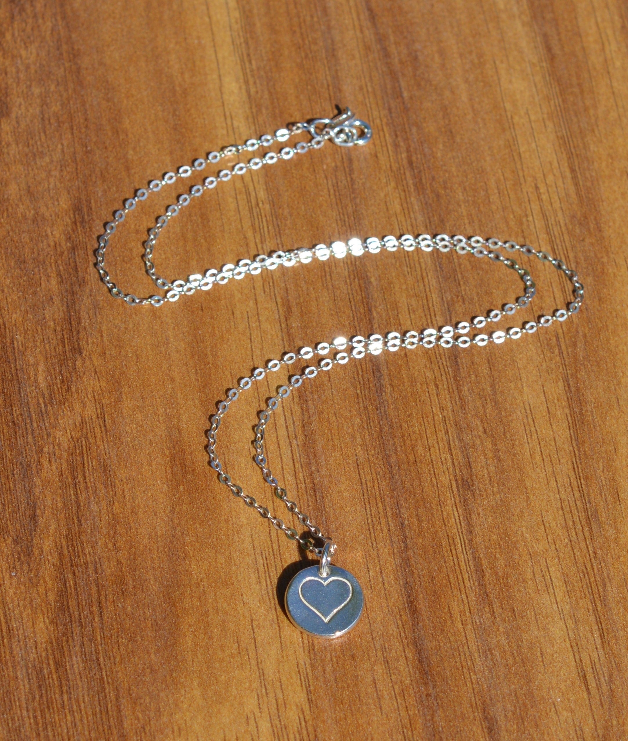 Blue Dragonfly Creations minimalist fine silver heart pendant necklace on a delicate 925 sterling silver chain.