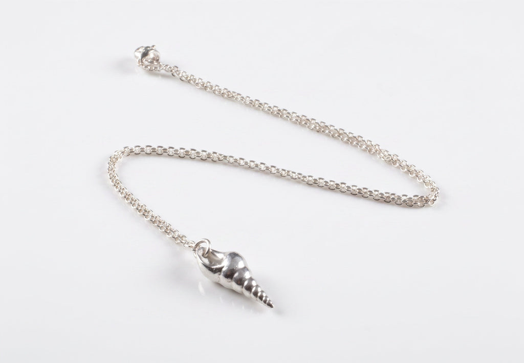 Blue Dragonfly Creations fine 999 silver seashell pendant on a delicate sterling silver chain with a polished finish.