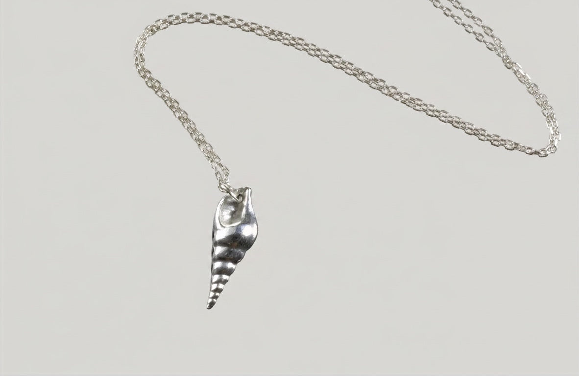Blue Dragonfly Creations fine 999 silver seashell pendant on a delicate sterling silver chain with a mirror polish.