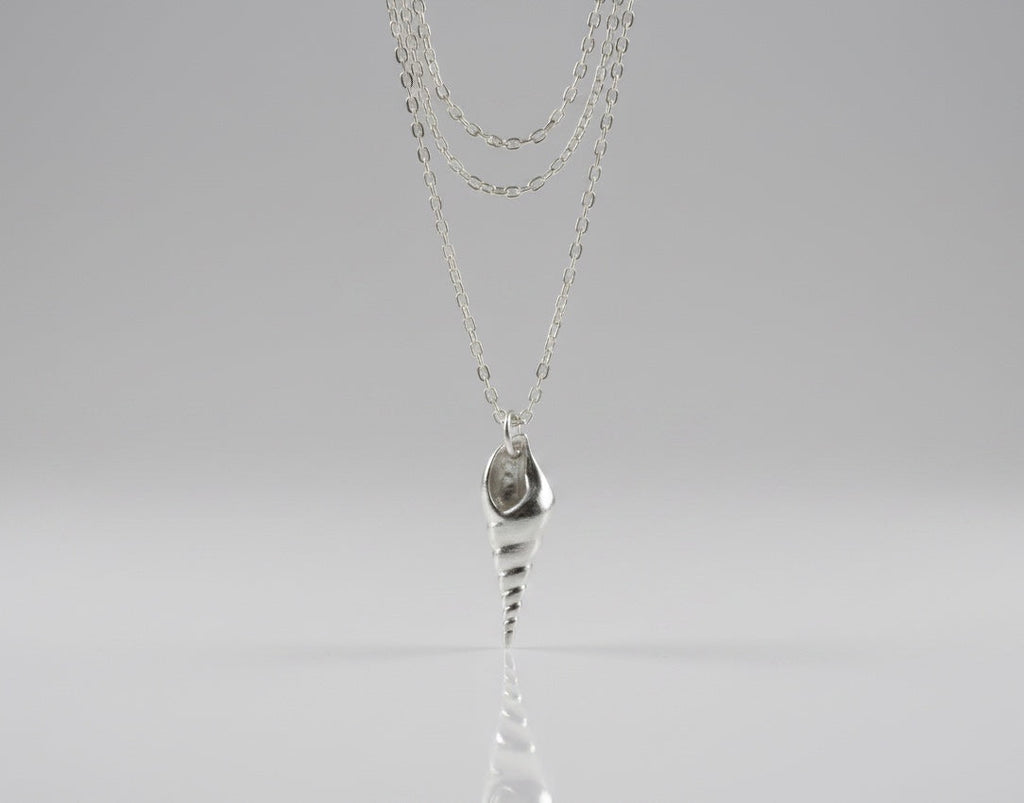 Blue Dragonfly Creations fine 999 silver seashell pendant necklace on a delicate sterling silver chain.