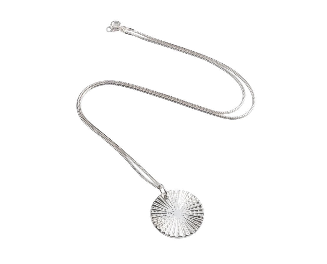 Blue Dragonfly Creations fine silver sunburst disc pendant necklace on a delicate sterling silver chain.