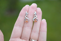 Hessonite Garnet & Sterling Silver Stud Earrings, Natural Orange Gemstone with Eternal Symbol